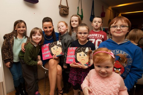 Sarah with young fans at the launch of her book, The Girl Who Wouldn't Smile.
