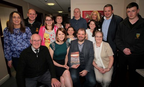 Kieran Kelly with his parents Hugh and Bridget, fiance Olivia Wilson and family members at the launch of the book. 