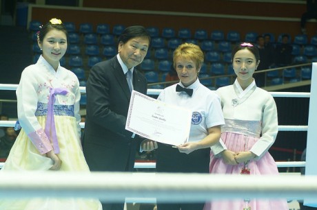 Sadie Duffy receives her certificate from Dr CK Wu, the AIBA President