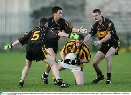 John McEntee of Crossmaglen is surrounded by Mark McGowan, Rory Kavanagh and Kevin Rafferty in 2008.