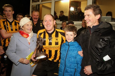 John Haran receives his Man of the Match award - the Peadar McGeehin Memorial trophy - from members of the McGeehin family on Sunday. Photo: Declan Doherty