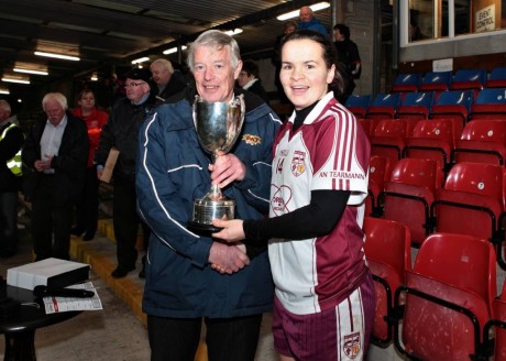 Geraldine McLaughlin is presented with the Ulster Cup following Sunday's game.