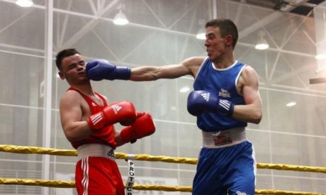 Noel McBride (blue) lands a punch