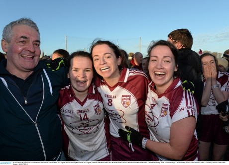 Termon team-mates and sisters from left Geraldine McLaughlin, Sharon McLaughlin and Nicole McLaughlin, celebrate with their father after the final whistle. 