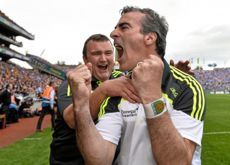 Donegal manager Jim McGuinness celebrates with kitman Joe McCloskey at the end of the All-Ireland semi-final.