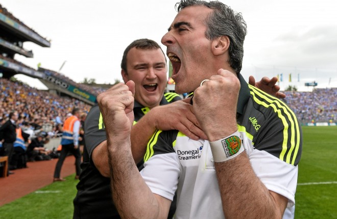 Donegal manager Jim McGuinness celebrates with kitman Joe McCloskey at the end of the All-Ireland semi-final.