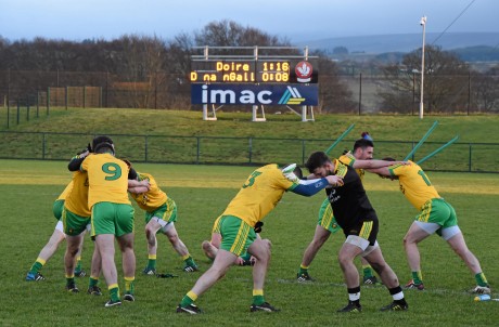 Donegal players warm down following their defeat to Derry.