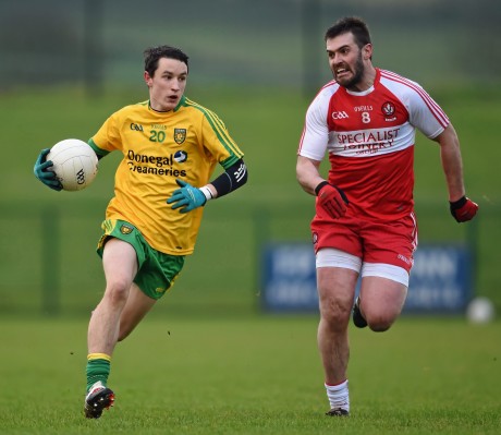 Eoin McHugh in action against Mark Lynch, Derry, in the Dr McKenna Cup.