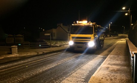 A council gritter on the N56 road at Loughanure just before midnight Saturday. Photo: Eoin McGarvey