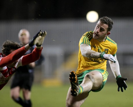 Donegal's Patrick McBrearty kicks a point against Derry.