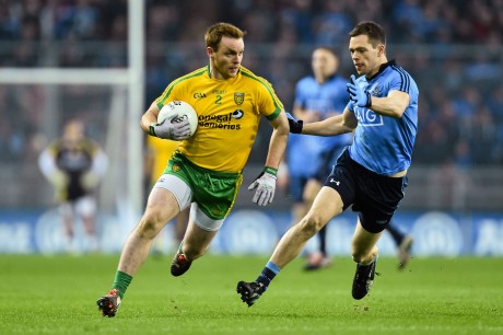Eamonn Doherty  in action against Dean Rock on Saturday night. Photo: Ramsey Cardy/SPORTSFILE