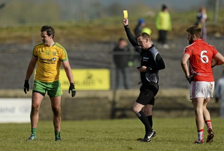 ichael Murphy, Donegal receives a second yellow card from Referee Joe McQuillan after a foul on Eoin Cadogan, right.