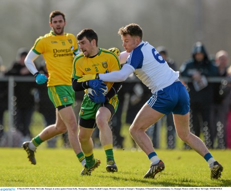 Paddy McGrath, Donegal, in action against Fintan Kelly, Monaghan. 