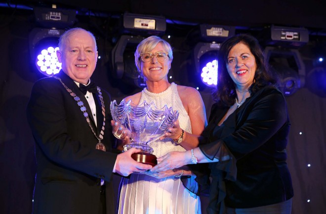 Martin McGettigan, president and Sorcha Ni Domhnaill, chairman of the Donegal Association in Dublin present the 2014 Donegal Person of the Year award to Moya Doherty in the Regency Hotel, Dublin last March. Picture: Declan Doherty.