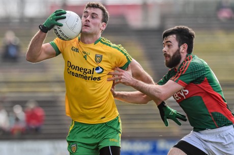 Eamon McGee, Donegal, in action against Kevin McLoughlin, Mayo. 