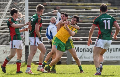 Mark and Ryan McHugh, Donegal, tussles with  Mayo's Kevin Keane and Neil Douglas, at the end of the game after his team-mate Stephen Griffen, had scored a point resulting in Donegal reaching the Allianz Football League, Division 1 semi final. Photo: David Maher/Sportsfile