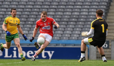 rian Hurley shoots past the Donegal goalkeeper Michael Boyle to score Cork's third goal in the 40th minute.
