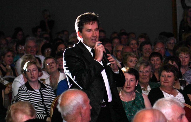 Daniel O'Donnell signs in the crowd in Dungloe at a previous concert.