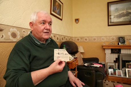 Kevin McFadden holding his match ticket. Photo: Declan Doherty