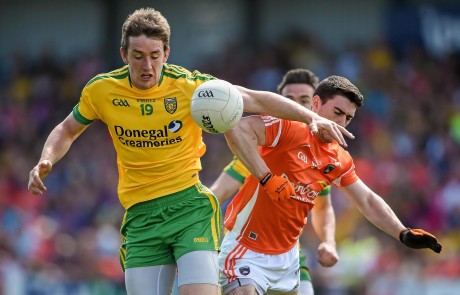 Hugh McFadden, Donegal, in action against Caolan Rafferty, Armagh.