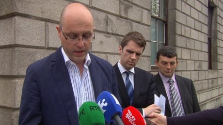 Seamus Hamilton speaking outside the High Court today. He is flanked by his solicitor as well as his late wife's brother, Garvan Connolly (right).