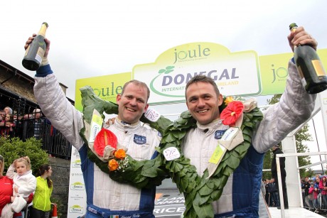 Local men Manus Kelly and Donall Barrett celebrate at the finish ramp after winning the National Rally. Photo: Donna El Assaad