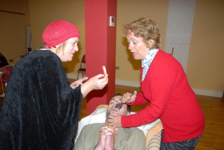 Rose (Mary Laverty on Left) and Margaret (Kathleen McGowan) with Tom's false teeth during rehearsals.