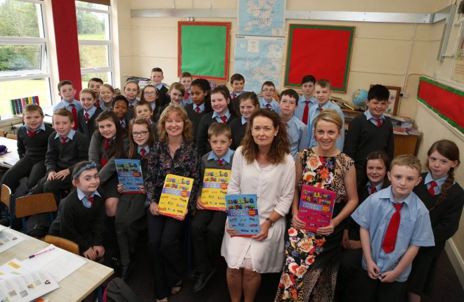 Louise Finnegan with colleagues Susan Doherty, principal, Maeliosa McAteer and pupils of Drumoghill National School.