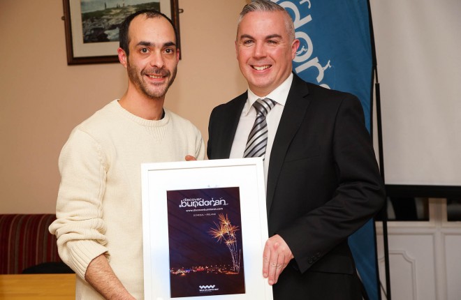 Claudio Salviato (left) with this year's cover along with Bundoran Tourism Officer, Shane Smyth.
