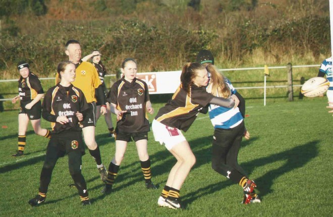 Eimer Alcorn tackling a Dungannon forward with Yasmin Sparks, Sara McBrearty and Chloe Wilkin looking on.