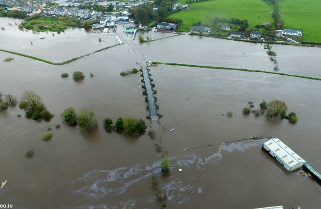 This drone picture was taken yesterday by Matthew Kelly of www.dronevideo.ie over the overflowing River Finn at Clady. What looks like a oil slick can been seen coming from a petrol station on the Castlefinn side of the border, Clady bridge in the centre and Clady village in the background.