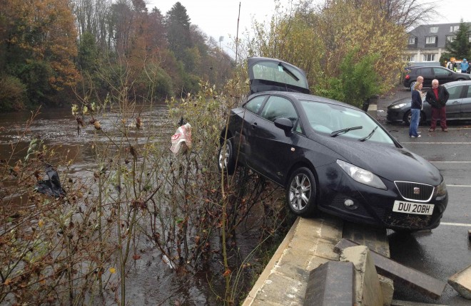 Another car almost swept away from Jackson's car park.