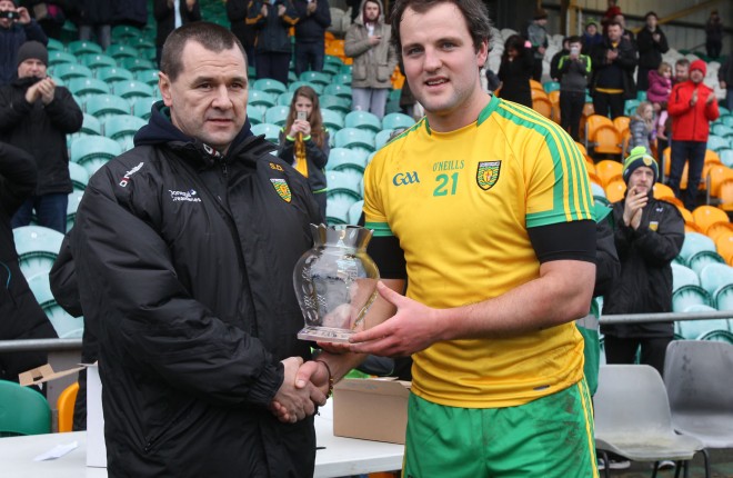 County Chairman Sean Dunnion makes a presentation to Michael Murphy on the occasion of his 100th appearance for Donegal.