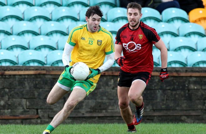 Odhran MacNiallais, Donegal in possession against Ryan Boyle of Down in the McKenna Cup clash Photos: Donna El Assaad