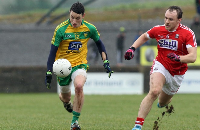 Eoin McHugh, Donegal in action against Brian O'Driscoll, Cork.