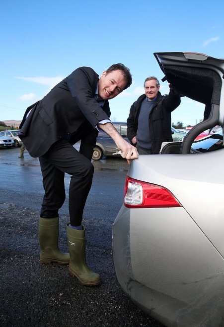Fianna Fail Charlie McConalogue gets into his wellies for a canvass of Milford Mart. Included is Jim Friel.