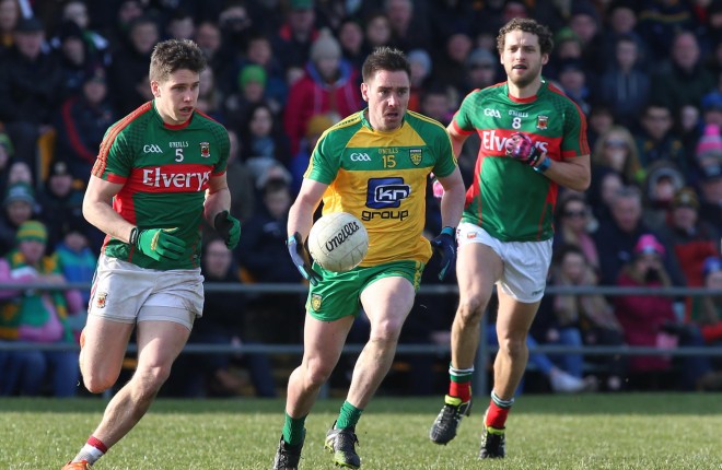 Marty O'Reilly, Donegal in action against Lee Keegan and Tom Parsons.