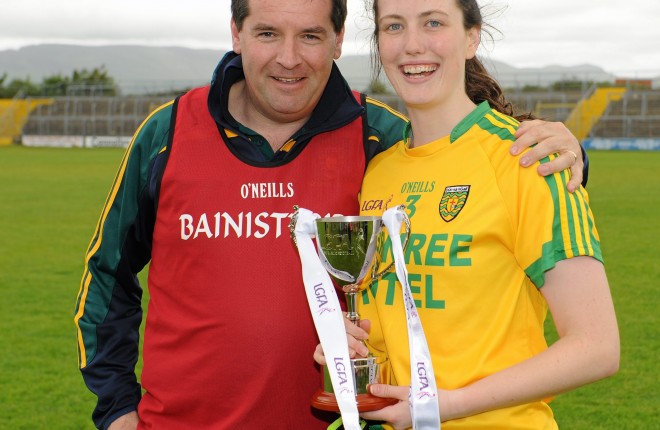 21 June 2015; Donegal Manager Davy McLaughlin and Captain Emer Gallagher pose with the trophy after their team's victory. Aisling McGing U21 B Championship Final, Donegal v Longford, Markiewicz Park, Sligo. Picture credit: Seb Daly / SPORTSFILE