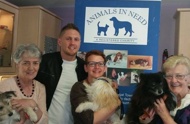 Volunteers from the charity, Animals in Need with boxer, Jason Quigley