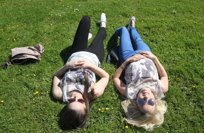 Sunny days in Donegal.... Sisters Kalyn and Aisling Mulligan relax in the sunshine at Letterkenny Town Park on Wednesday afternoon. Photo: Donna El Assaad