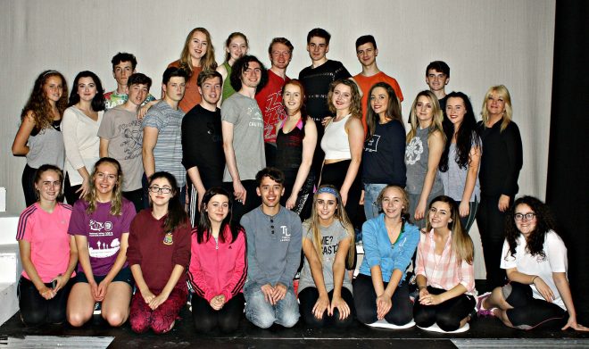 The cast of 'Grease' with director, Caroline Bell.