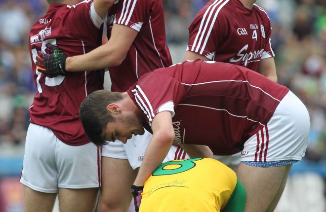 Disappointment for Donegal as Galway celebrate at the final whistle.