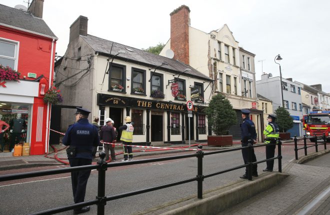 Gardai and Fire service personnel at the scene of a fire at the Central Bar, Letterkenny this morning.