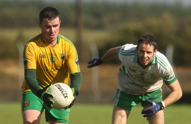 Ryan McNern, Naomh Columba gets past St. Naul's Conor McBrearty during the intermediate championship semi final.