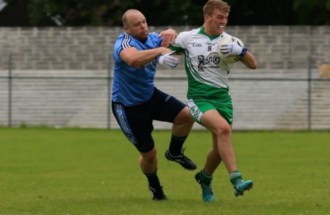 Milford's Paddy Peoples tackles Niall Harley of Aodh Ruadh