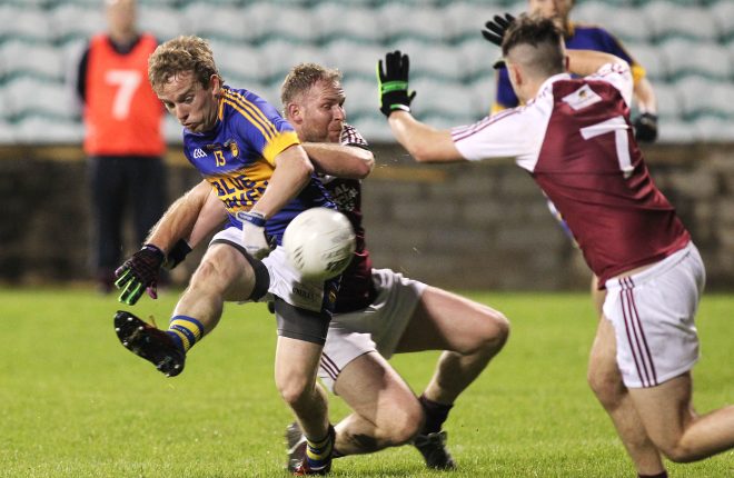 Dara O'Donnell, Kilcar feels the challenge by Jamie Gallagher, Termon. Photo: Donna El Assaad