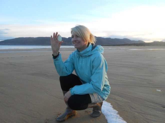 Helen collecting another fine piece of seaglass from the beach at Portsalon. 