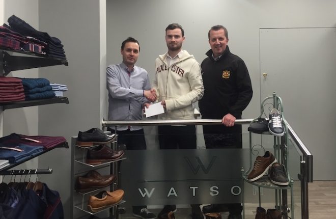 Peter is pictured receiving his award from Paul Moore (left) of Watson Menswear and USL Secretary Niall Callaghan