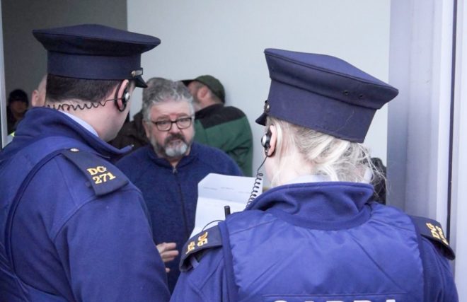 Michael McGee, 'The Helping Hand' spokesman in conversation with Gardai on Friday afternoon