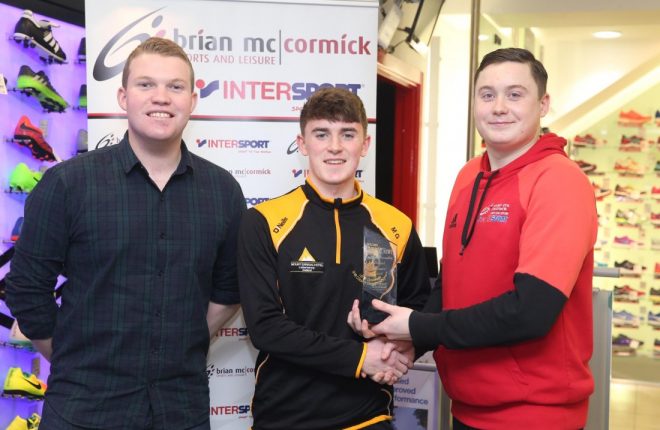 Dan O'Donnell, Brian McCormick Sports, presents Michael Gallagher with the Donegal News Sports Star of the Month award for December. Also pictured is Ryan Ferry (left) of the Donegal News.